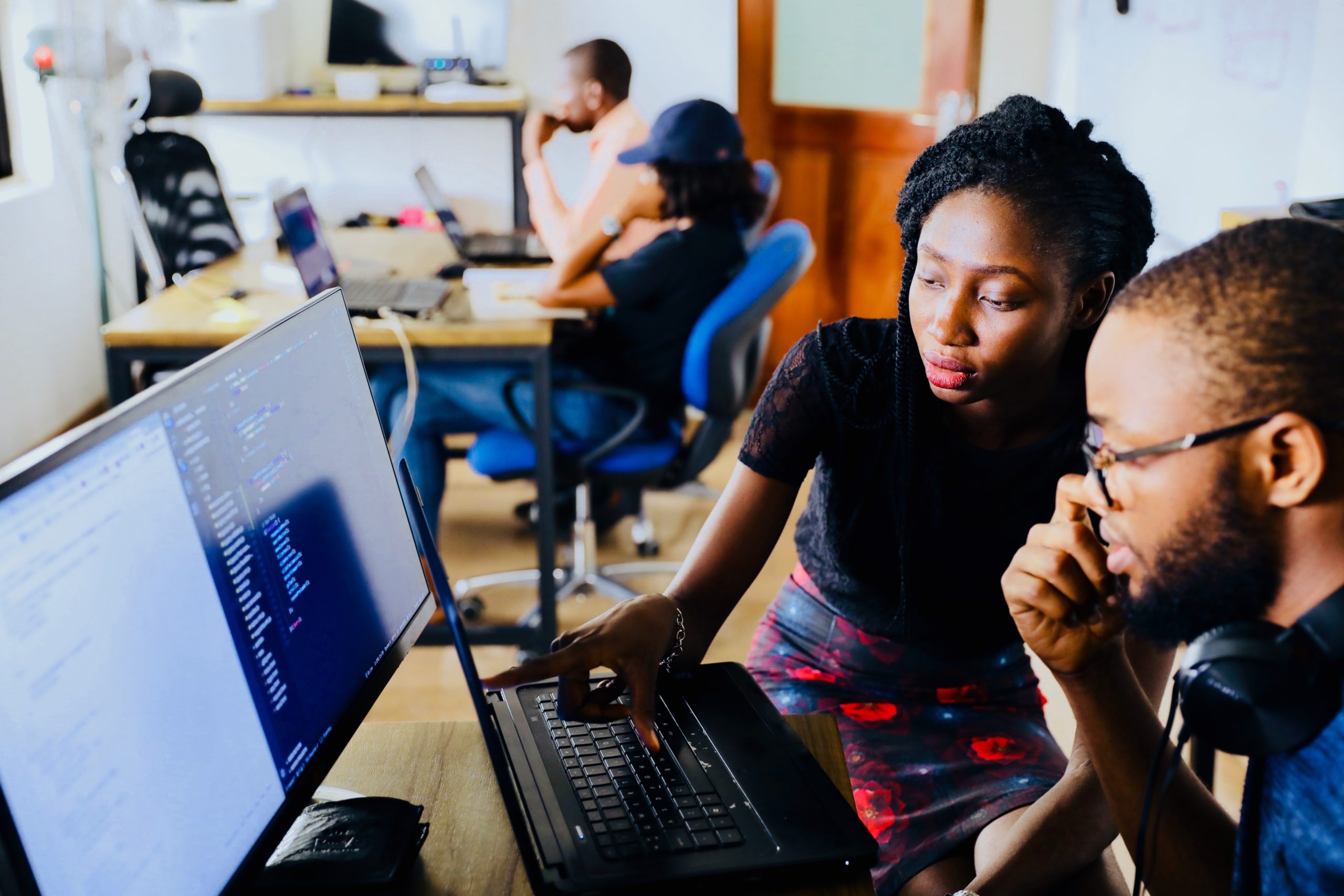 people looking at desktop computer