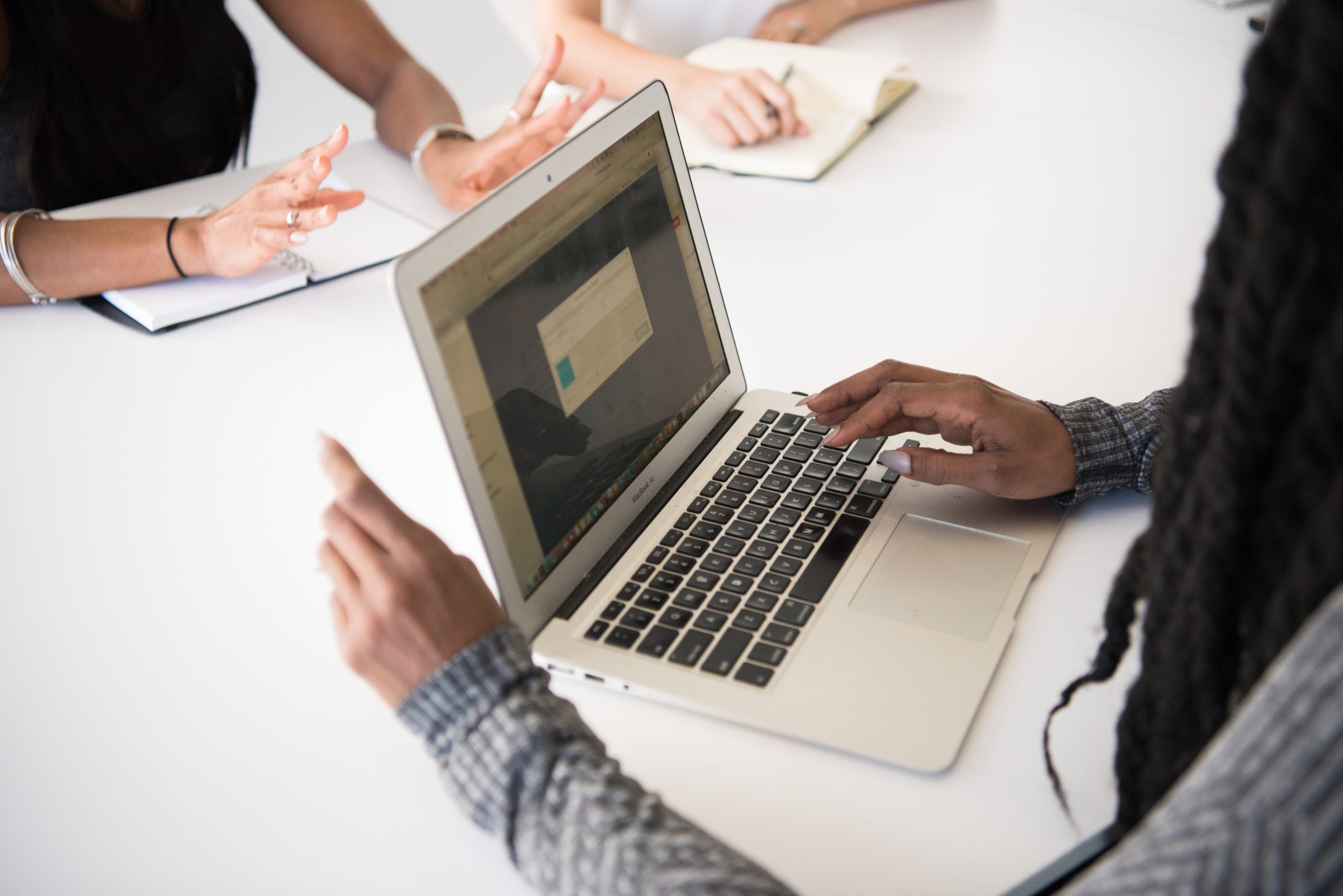 woman using macbook