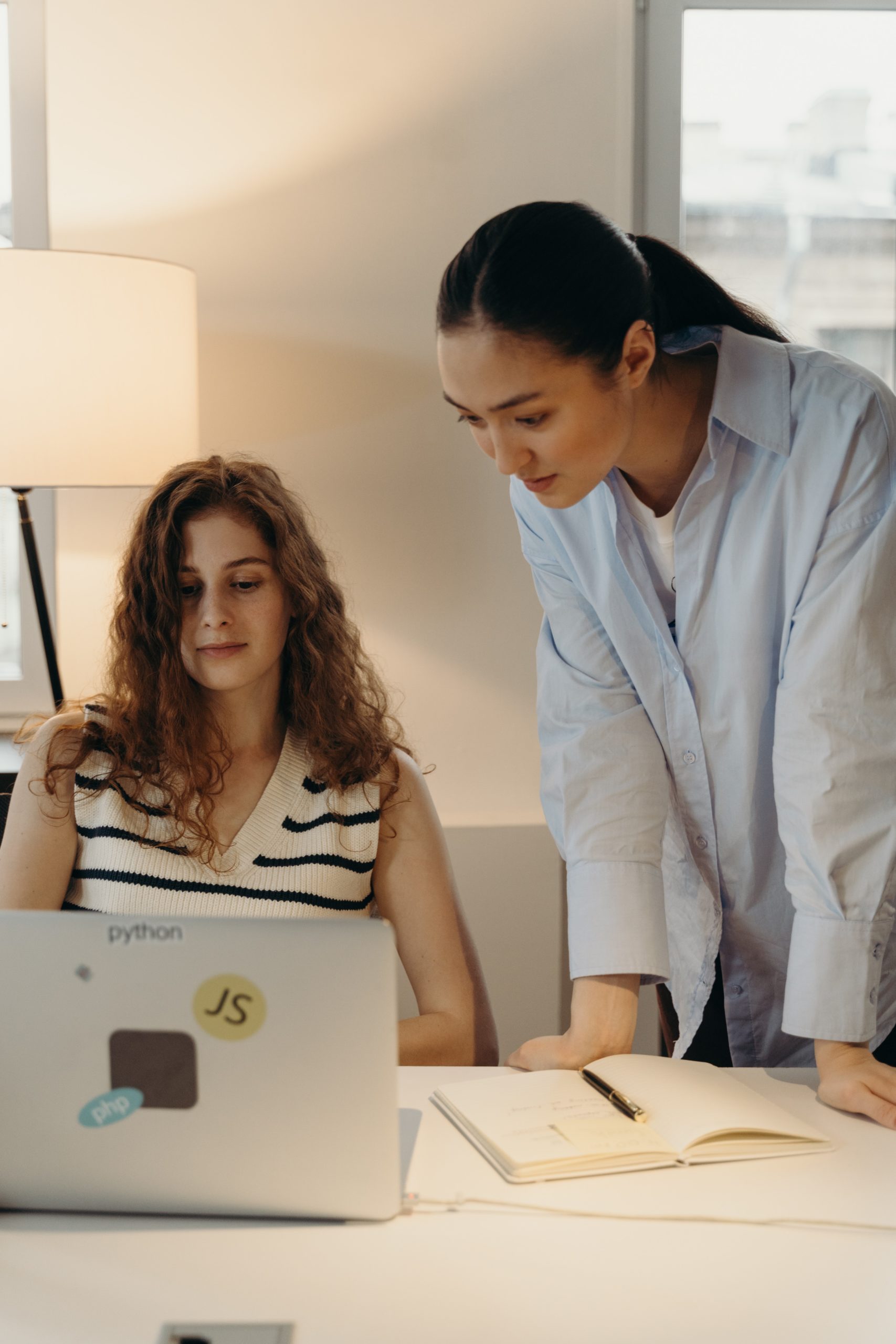 coworkers looking at laptop together