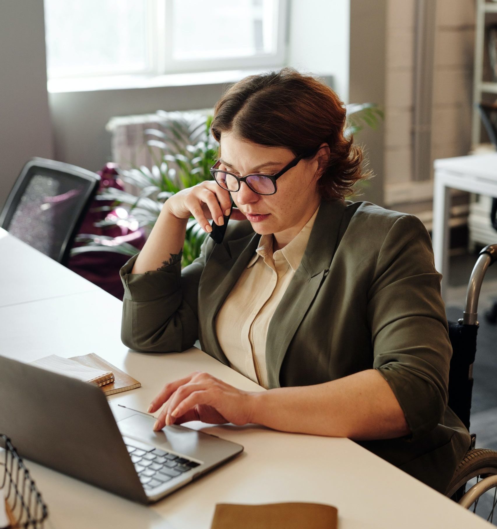 woman focused on laptop work