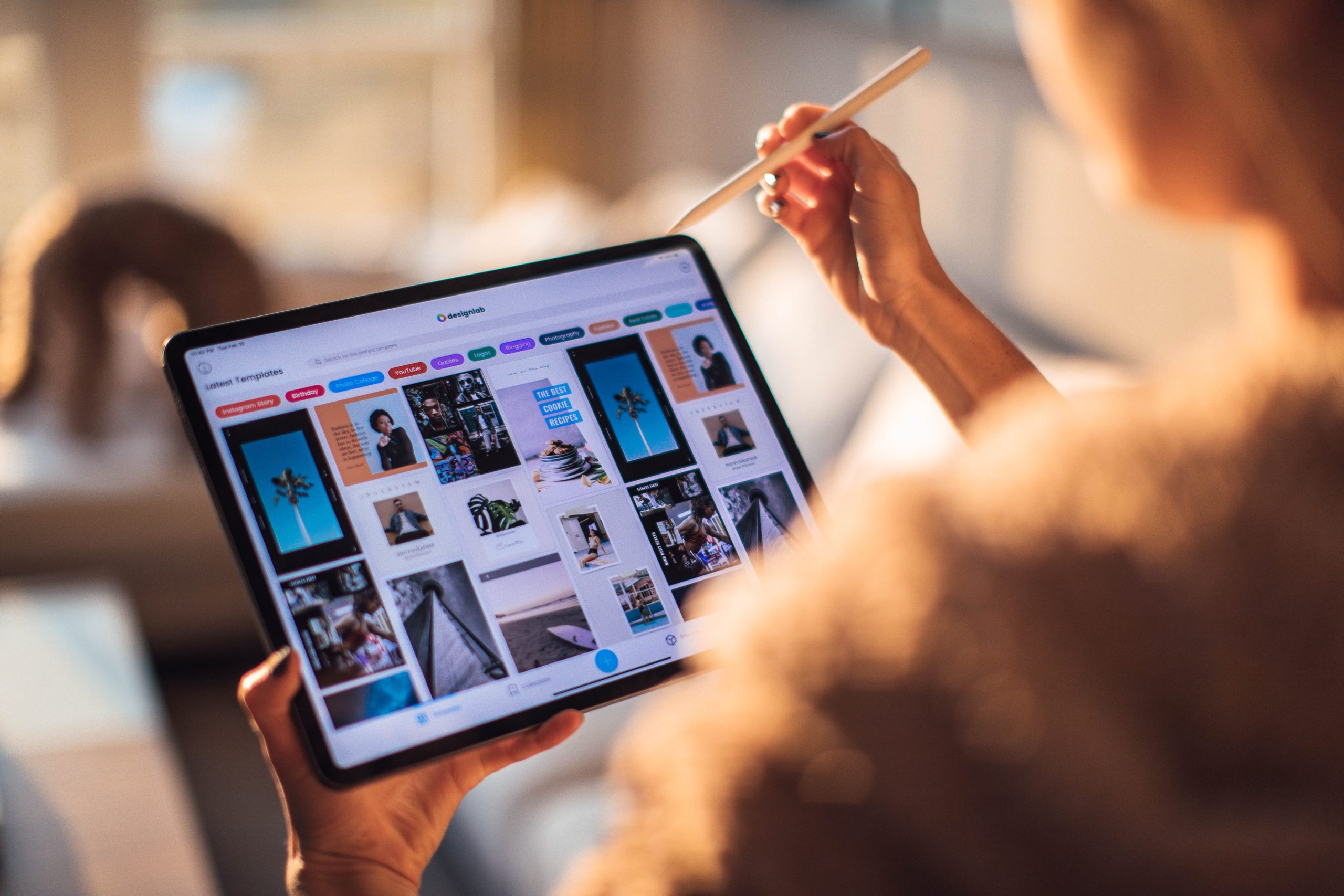 person using tablet to look at images