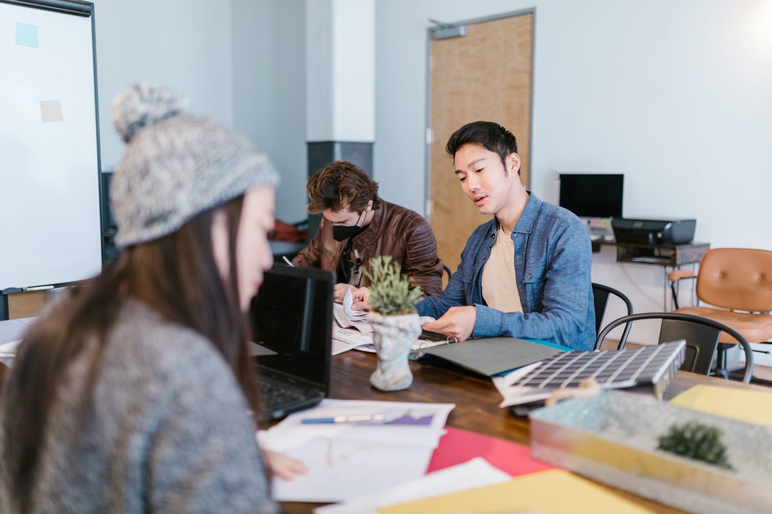 coworkers using table to work