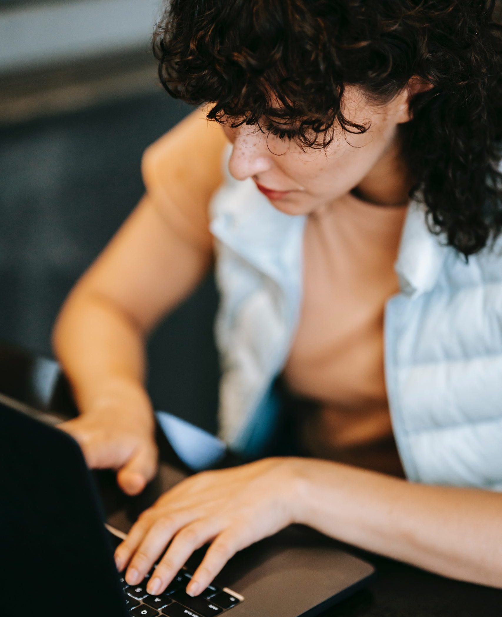 woman typing on laptop