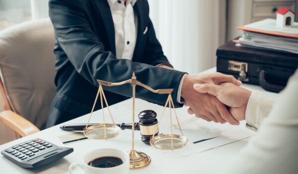 Businessman shaking hands to seal a deal with his lawyer or attorney